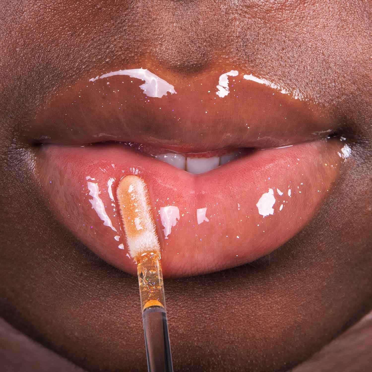lethal-cosmetics-dexter-m99-lipgloss-sheer-orange-schimmer image 2